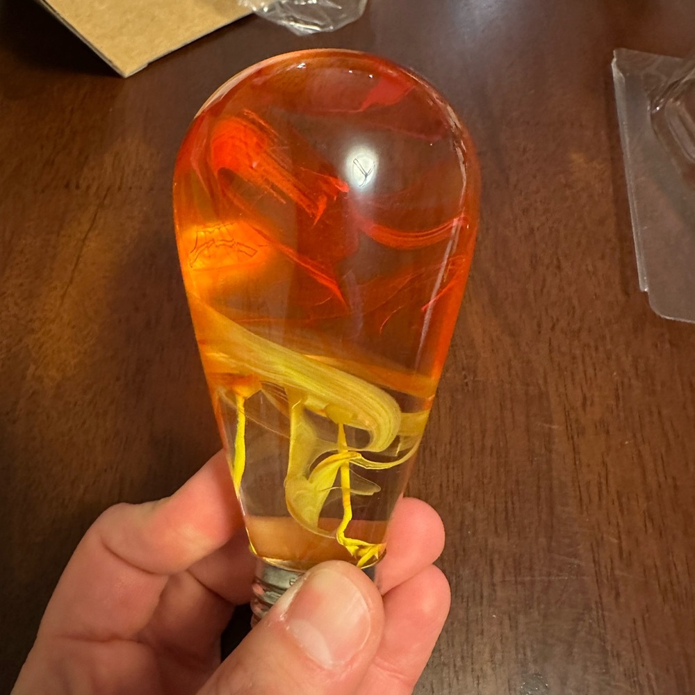 Artistic Glass Light Bulb with Red and Yellow Swirls